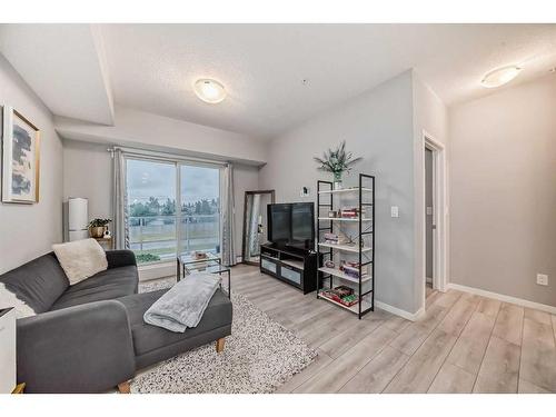 303-360 Harvest Hills Common Ne, Calgary, AB - Indoor Photo Showing Living Room