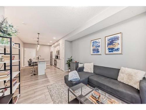 303-360 Harvest Hills Common Ne, Calgary, AB - Indoor Photo Showing Living Room