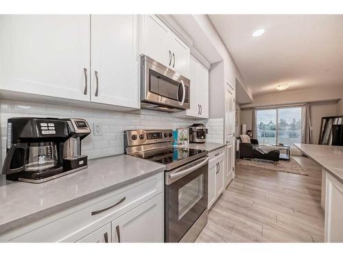 303-360 Harvest Hills Common Ne, Calgary, AB - Indoor Photo Showing Kitchen With Stainless Steel Kitchen With Upgraded Kitchen