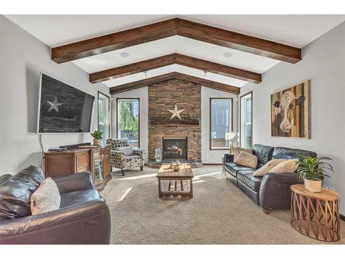 22 Cranarch Link Se, Calgary, AB - Indoor Photo Showing Living Room With Fireplace