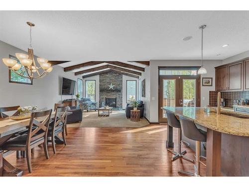 22 Cranarch Link Se, Calgary, AB - Indoor Photo Showing Dining Room With Fireplace