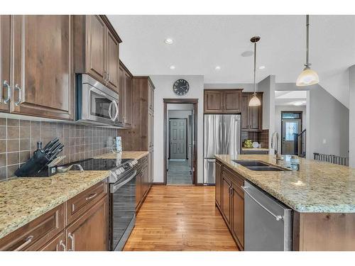 22 Cranarch Link Se, Calgary, AB - Indoor Photo Showing Kitchen With Double Sink With Upgraded Kitchen