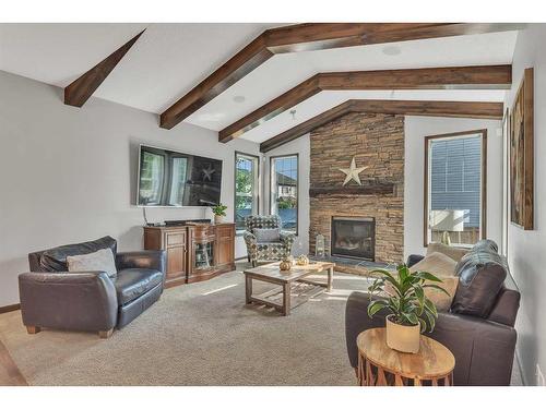 22 Cranarch Link Se, Calgary, AB - Indoor Photo Showing Living Room With Fireplace