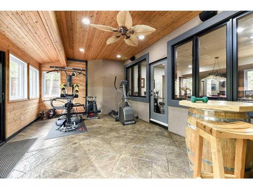 54 Rockcliff Landing Nw, Calgary, AB - Indoor Photo Showing Gym Room