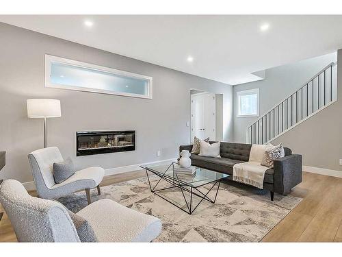 339 Hendon Drive Nw, Calgary, AB - Indoor Photo Showing Living Room With Fireplace