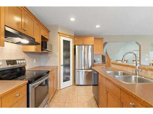 472 Bridlemeadows Common Sw, Calgary, AB - Indoor Photo Showing Kitchen With Double Sink