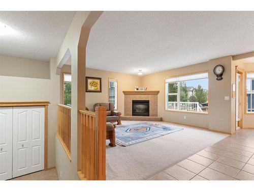 472 Bridlemeadows Common Sw, Calgary, AB - Indoor With Fireplace