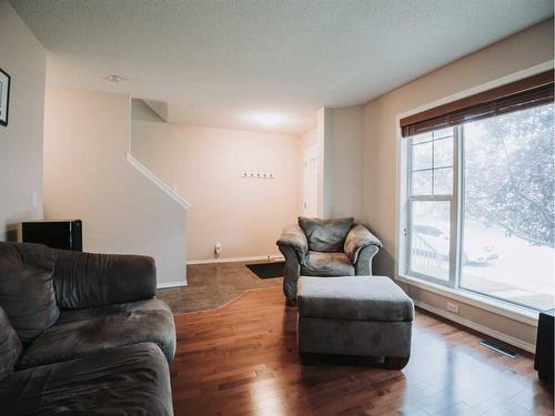 207 Cranberry Way Se, Calgary, AB - Indoor Photo Showing Living Room