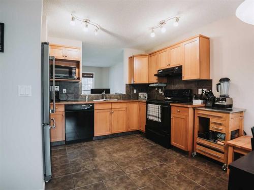 207 Cranberry Way Se, Calgary, AB - Indoor Photo Showing Kitchen With Double Sink