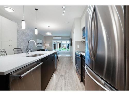 108-1720 10 Street Sw, Calgary, AB - Indoor Photo Showing Kitchen With Stainless Steel Kitchen With Upgraded Kitchen