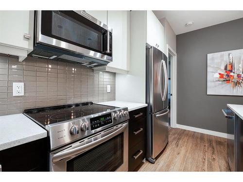 108-1720 10 Street Sw, Calgary, AB - Indoor Photo Showing Kitchen With Stainless Steel Kitchen With Upgraded Kitchen