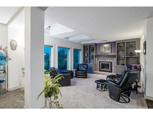 24 Christie Park Hill Sw, Calgary, AB - Indoor With Fireplace