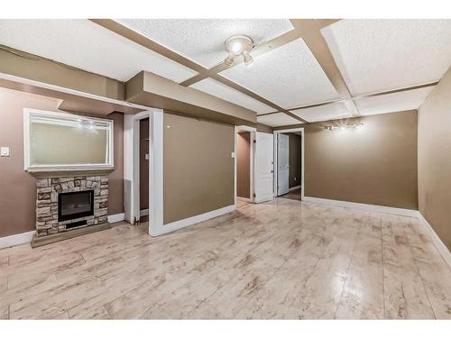 60 Springwood Drive Sw, Calgary, AB - Indoor Photo Showing Other Room With Fireplace