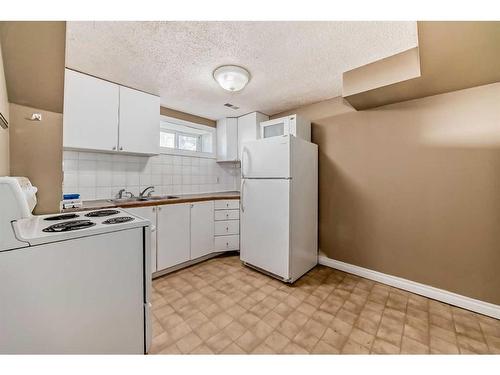 60 Springwood Drive Sw, Calgary, AB - Indoor Photo Showing Kitchen With Double Sink