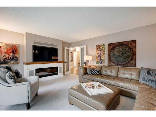 143 Parkview Green Se, Calgary, AB - Indoor Photo Showing Living Room With Fireplace