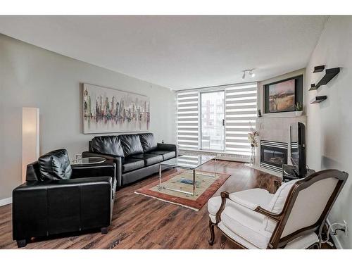 506-1108 6 Avenue Sw, Calgary, AB - Indoor Photo Showing Living Room With Fireplace