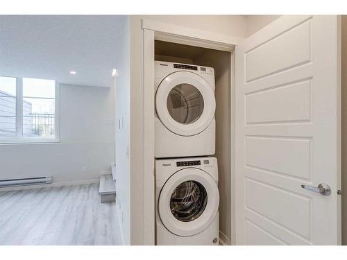 404-260 Rowley Way Nw, Calgary, AB - Indoor Photo Showing Laundry Room