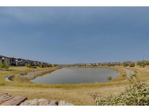 404-260 Rowley Way Nw, Calgary, AB - Outdoor With Body Of Water With View