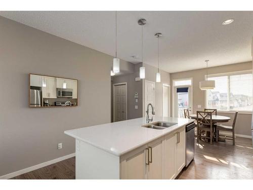 111 New Brighton Walk Se, Calgary, AB - Indoor Photo Showing Kitchen With Double Sink With Upgraded Kitchen