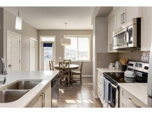 111 New Brighton Walk Se, Calgary, AB - Indoor Photo Showing Kitchen With Stainless Steel Kitchen With Double Sink