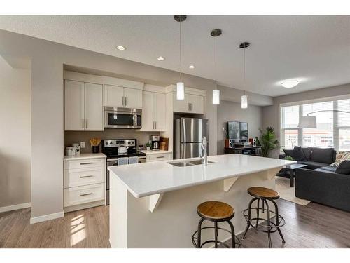 111 New Brighton Walk Se, Calgary, AB - Indoor Photo Showing Kitchen With Stainless Steel Kitchen With Double Sink With Upgraded Kitchen