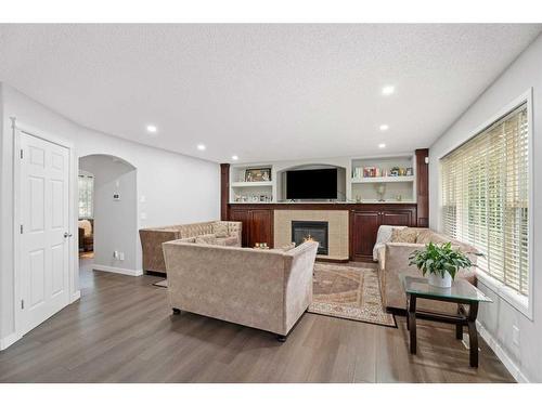 276 Cove Dr, Chestermere, AB - Indoor Photo Showing Living Room With Fireplace