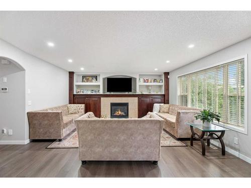 276 Cove Dr, Chestermere, AB - Indoor Photo Showing Living Room With Fireplace