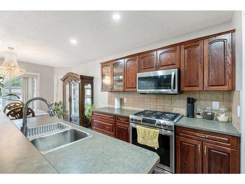 276 Cove Dr, Chestermere, AB - Indoor Photo Showing Kitchen With Double Sink