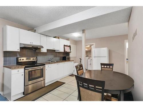 250 Saddlecrest Close Ne, Calgary, AB - Indoor Photo Showing Kitchen With Double Sink