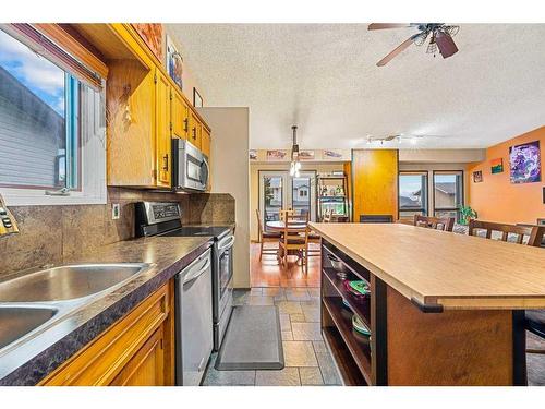 52 Hawkcliff Way Nw, Calgary, AB - Indoor Photo Showing Kitchen With Double Sink