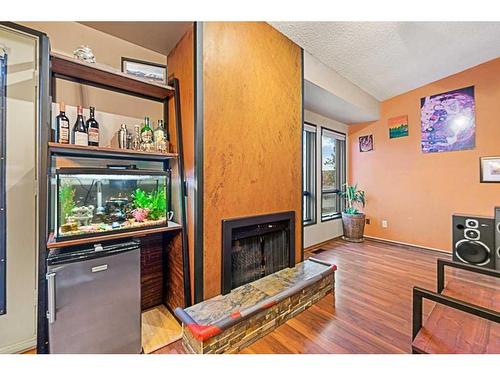 52 Hawkcliff Way Nw, Calgary, AB - Indoor With Fireplace