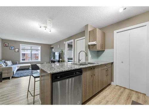 1513-4641 128 Avenue Ne, Calgary, AB - Indoor Photo Showing Kitchen With Double Sink