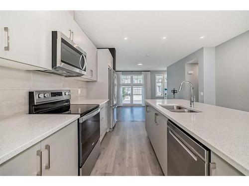 151 Magnolia Terrace Se, Calgary, AB - Indoor Photo Showing Kitchen With Stainless Steel Kitchen With Double Sink With Upgraded Kitchen