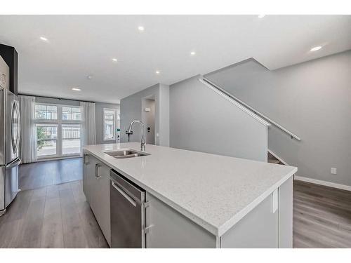 151 Magnolia Terrace Se, Calgary, AB - Indoor Photo Showing Kitchen With Double Sink