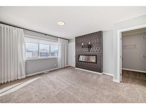 151 Magnolia Terrace Se, Calgary, AB - Indoor With Fireplace