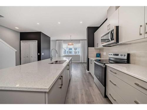 151 Magnolia Terrace Se, Calgary, AB - Indoor Photo Showing Kitchen With Stainless Steel Kitchen With Double Sink With Upgraded Kitchen