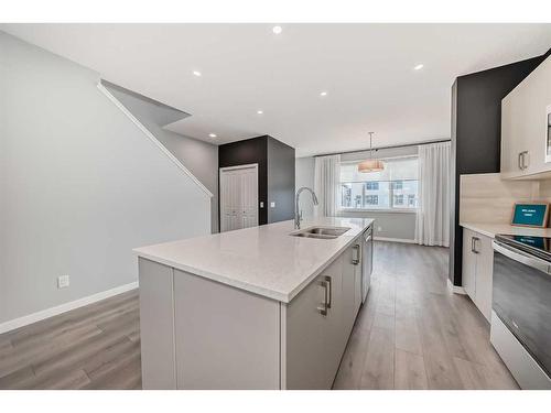 151 Magnolia Terrace Se, Calgary, AB - Indoor Photo Showing Kitchen With Stainless Steel Kitchen With Double Sink