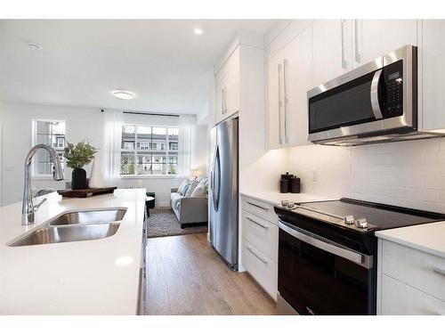 38 Dawson Drive, Chestermere, AB - Indoor Photo Showing Kitchen With Stainless Steel Kitchen With Double Sink With Upgraded Kitchen