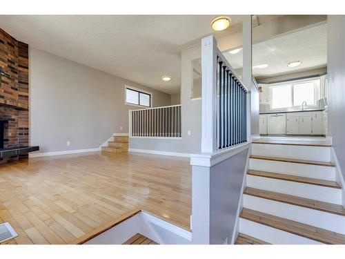 83 Lake Sylvan Close Se, Calgary, AB - Indoor Photo Showing Other Room With Fireplace