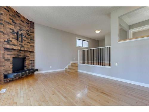 83 Lake Sylvan Close Se, Calgary, AB - Indoor With Fireplace