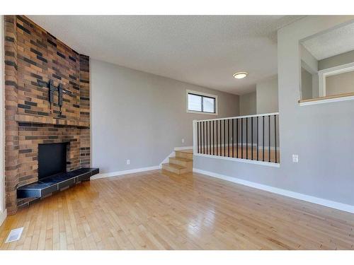 83 Lake Sylvan Close Se, Calgary, AB - Indoor With Fireplace