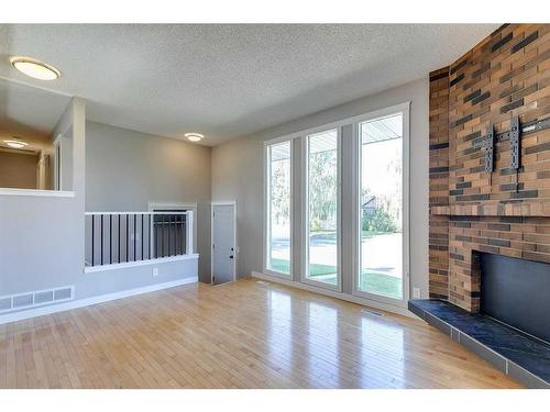 83 Lake Sylvan Close Se, Calgary, AB - Indoor With Fireplace