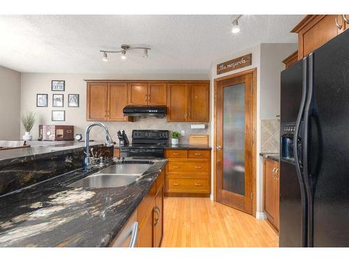 19 Copperfield Common Se, Calgary, AB - Indoor Photo Showing Kitchen With Double Sink