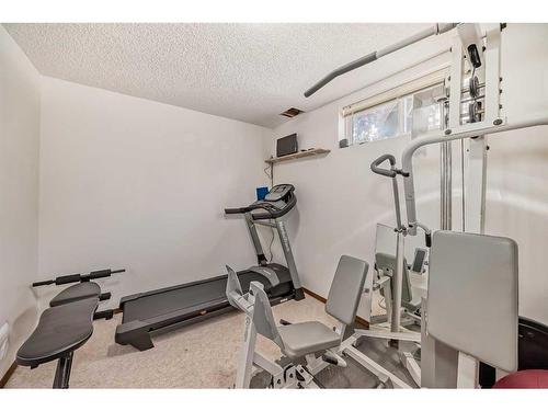 25 West Gissing Road, Cochrane, AB - Indoor Photo Showing Gym Room