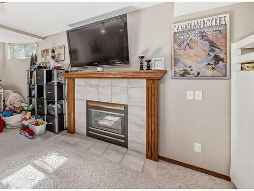 25 West Gissing Road, Cochrane, AB - Indoor Photo Showing Living Room With Fireplace