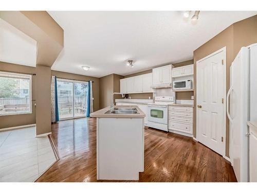 9 Spring Crescent Sw, Calgary, AB - Indoor Photo Showing Kitchen With Double Sink