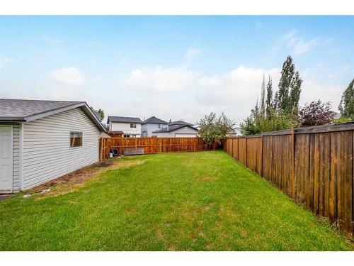 135 Mt Apex Crescent Se, Calgary, AB - Outdoor With Backyard