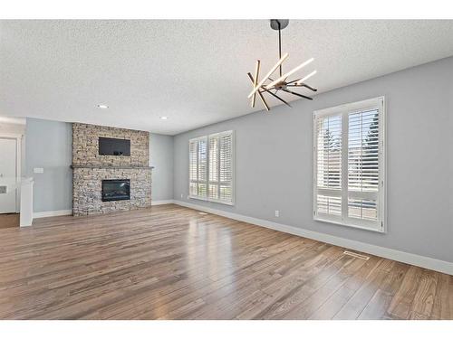 315 Woodridge Place Sw, Calgary, AB - Indoor Photo Showing Other Room With Fireplace