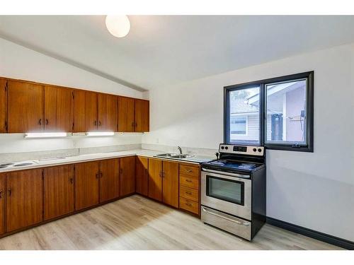 383 Acadia Drive Se, Calgary, AB - Indoor Photo Showing Kitchen With Double Sink