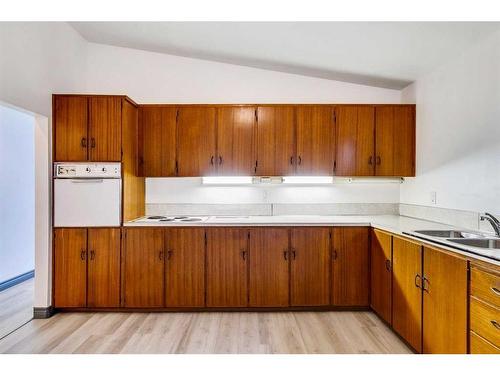 383 Acadia Drive Se, Calgary, AB - Indoor Photo Showing Kitchen With Double Sink